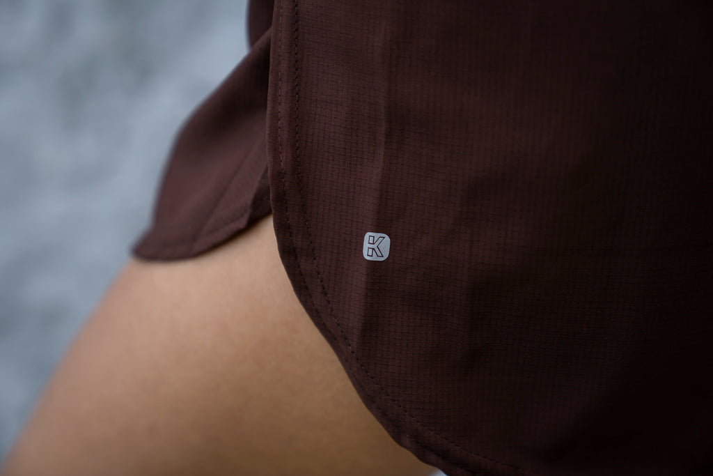 RUNNING SHORT MARRÓN MUJER UNISEX HOMBRE